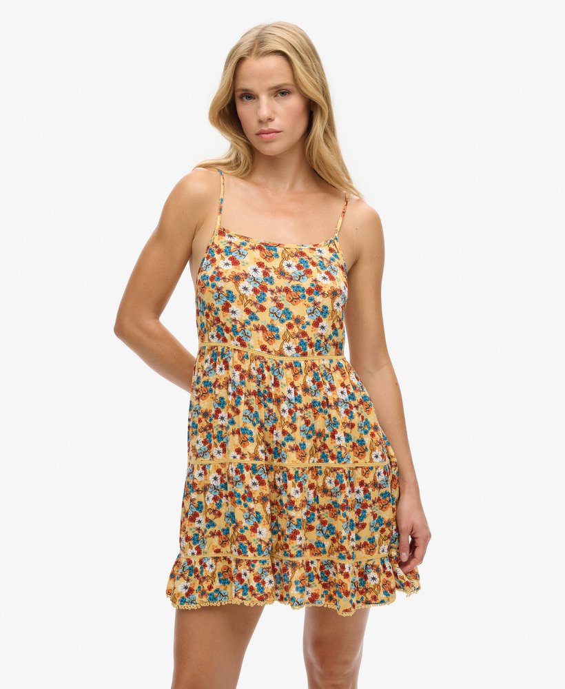 mini strandjurkje met camisole in een geel bloemenpatroon uit de jaren 70