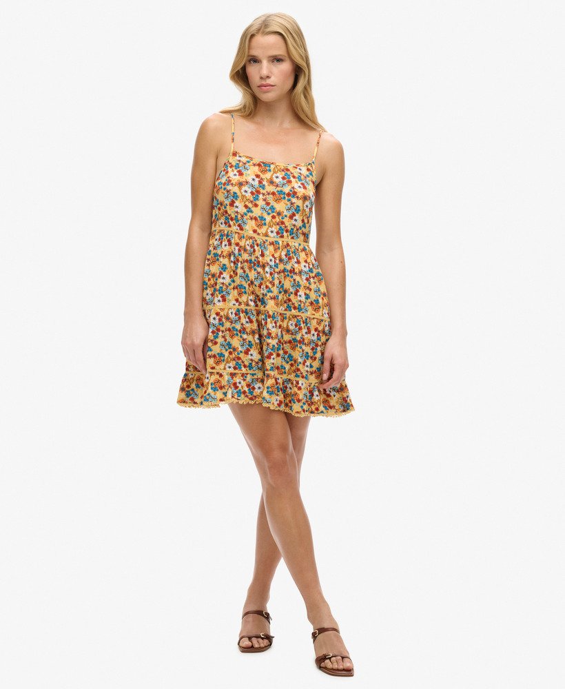 mini strandjurkje met camisole in een geel bloemenpatroon uit de jaren 70
