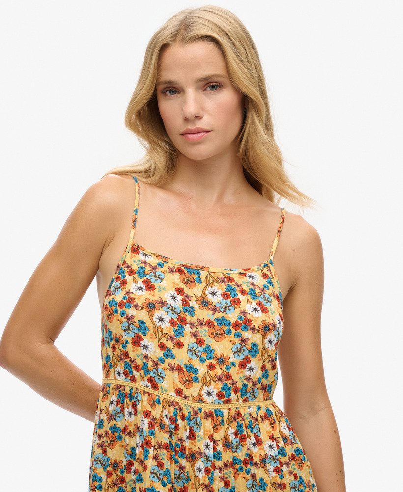 mini strandjurkje met camisole in een geel bloemenpatroon uit de jaren 70