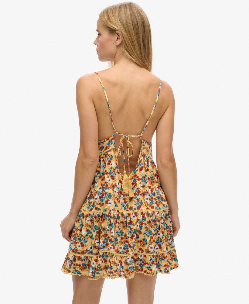 mini strandjurkje met camisole in een geel bloemenpatroon uit de jaren 70
