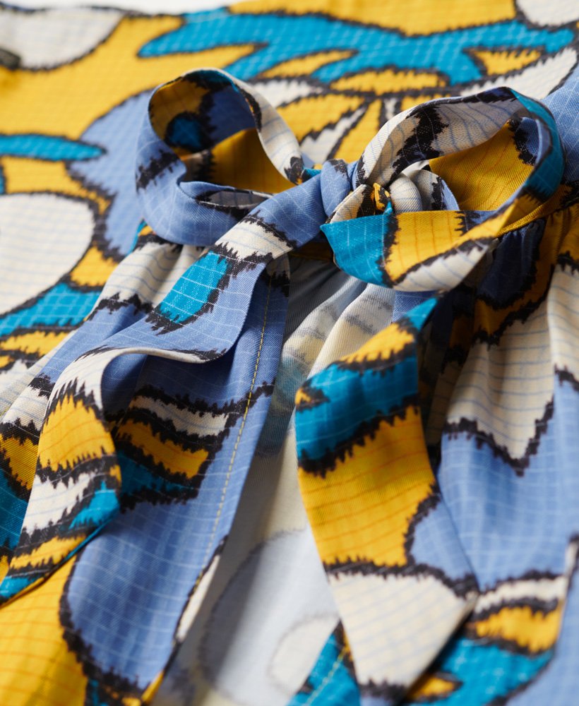 mouwloze mini-jurk met hoge hals in wolkgeel met bloemenprint