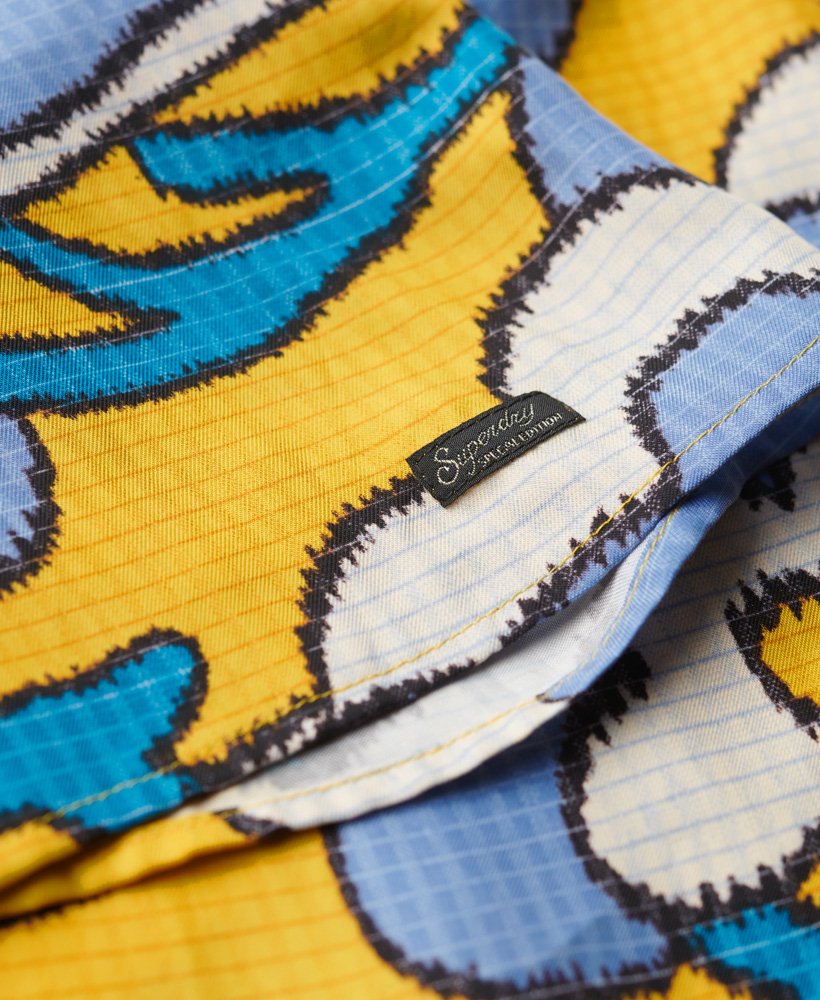 mouwloze mini-jurk met hoge hals in wolkgeel met bloemenprint