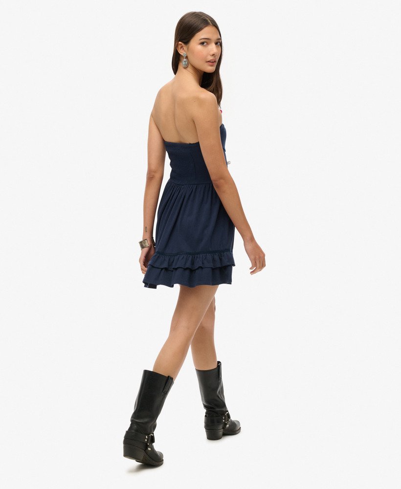 mini-jurk met kanten bandeau uit de jaren 50 in een prachtige marineblauwe kleur.