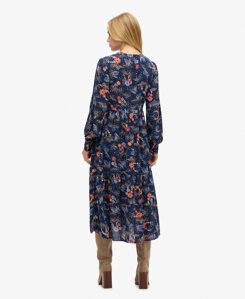 midi-jurk met lange mouwen en ruches in een blauwe alma-bloemenmix.