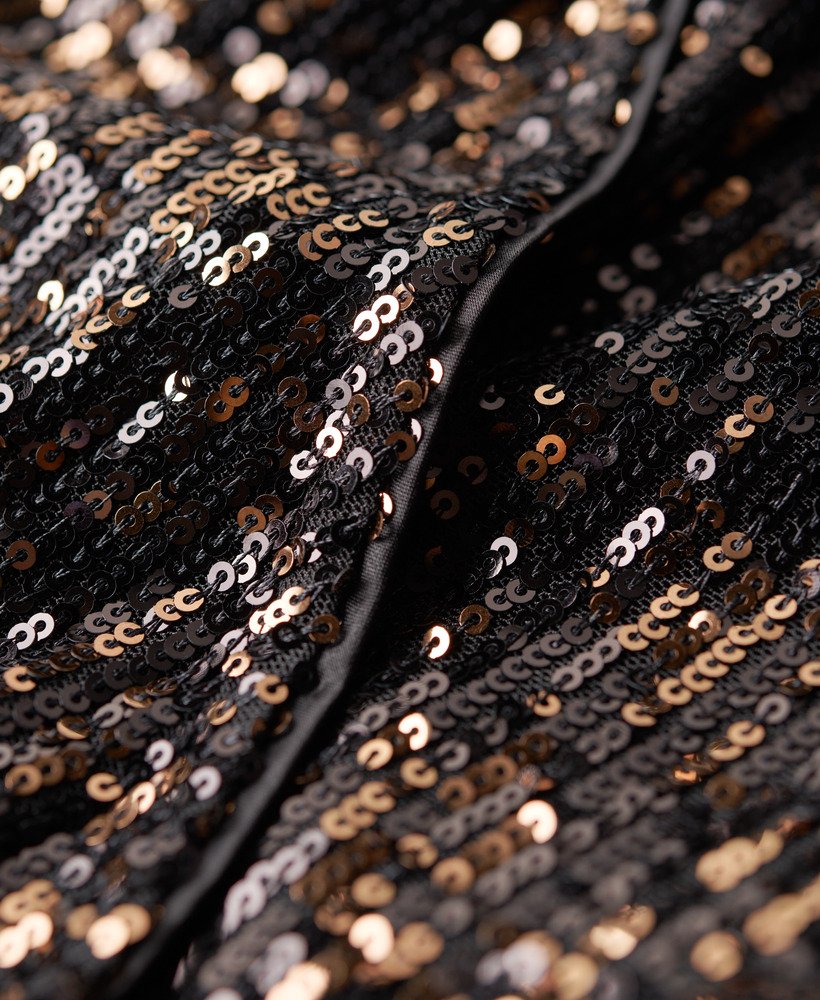 maxi-jurk met pailletten en wikkeldetail in koperzwart.