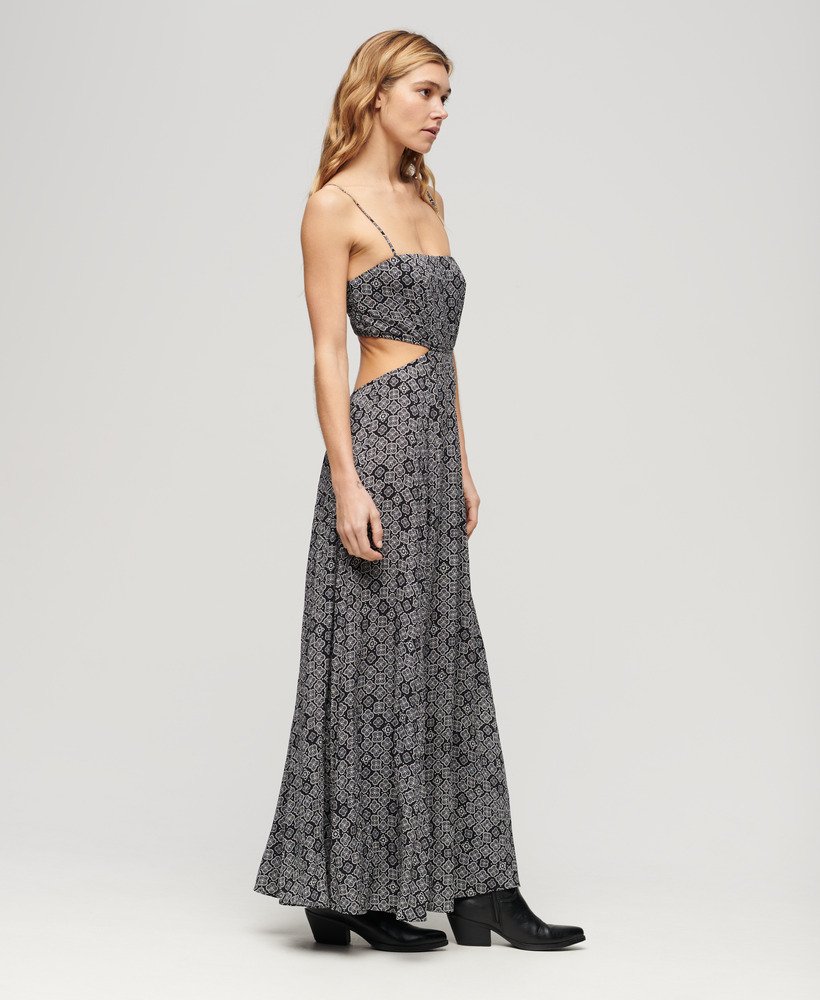 maxi-jurk met transparante achterkant in zwart jaren 70 geometrische stijl.