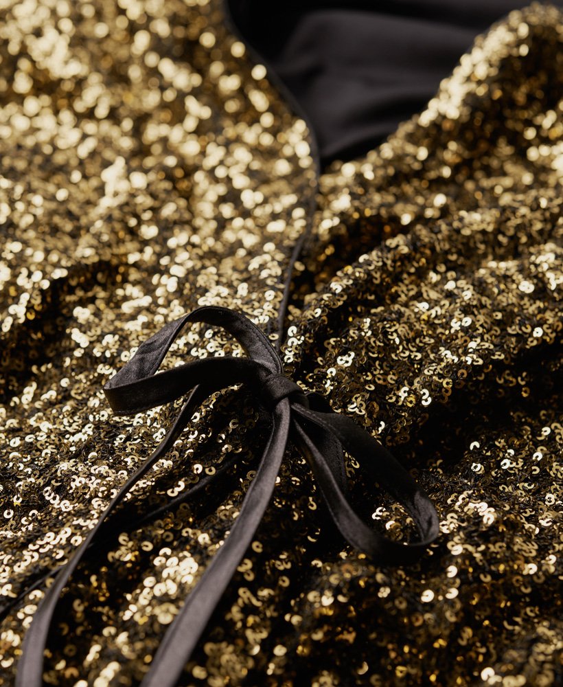 mini-jurk met pailletten en wikkeldetail in goudkleurige mega-pailletten