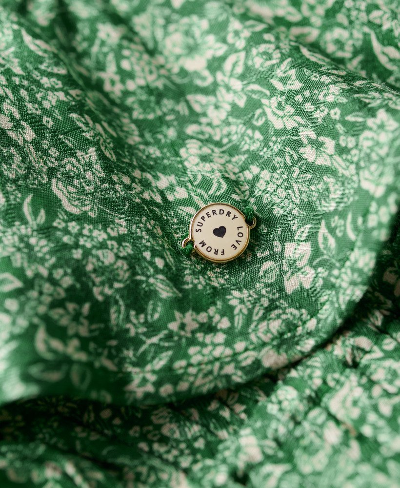 bedrukte mini-jurk met lange mouwen en overslagprint in een weelderig groen.