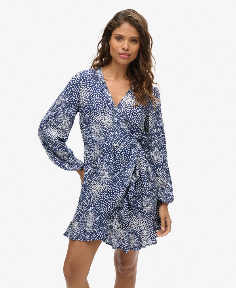 bedrukte mini-jurk met lange mouwen en overslagprint in een donkerblauwe kleur met verspreide stippen.