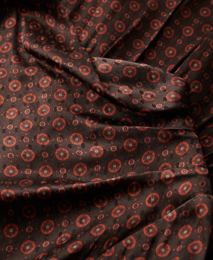 mini jacquardjurk met colkraag in geometrisch patroon in oranje.