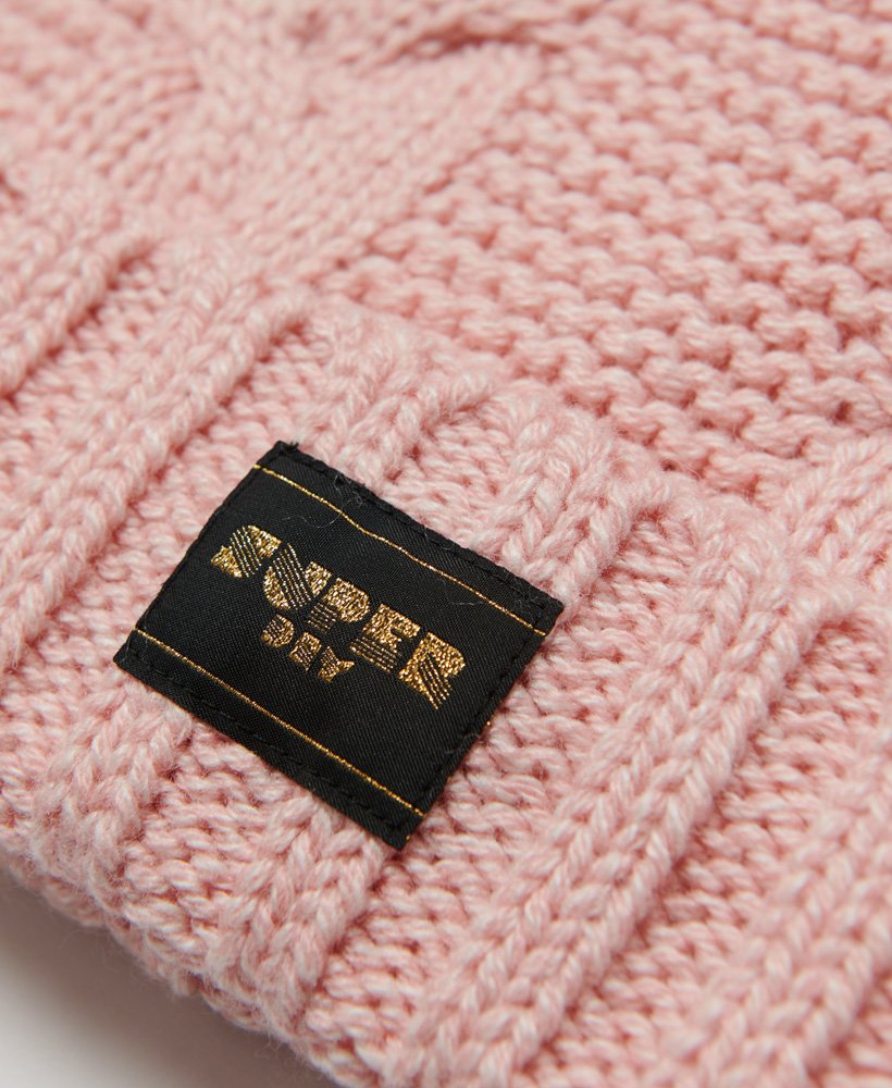 kabelgebreide muts met roze spikkels
