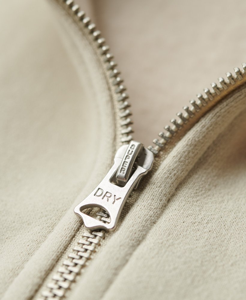 essential logo zip track top in light stone beige