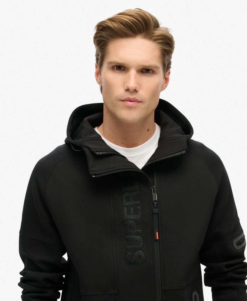 hoodie met losvallend tech-logo en ritssluiting in zwartoranje.