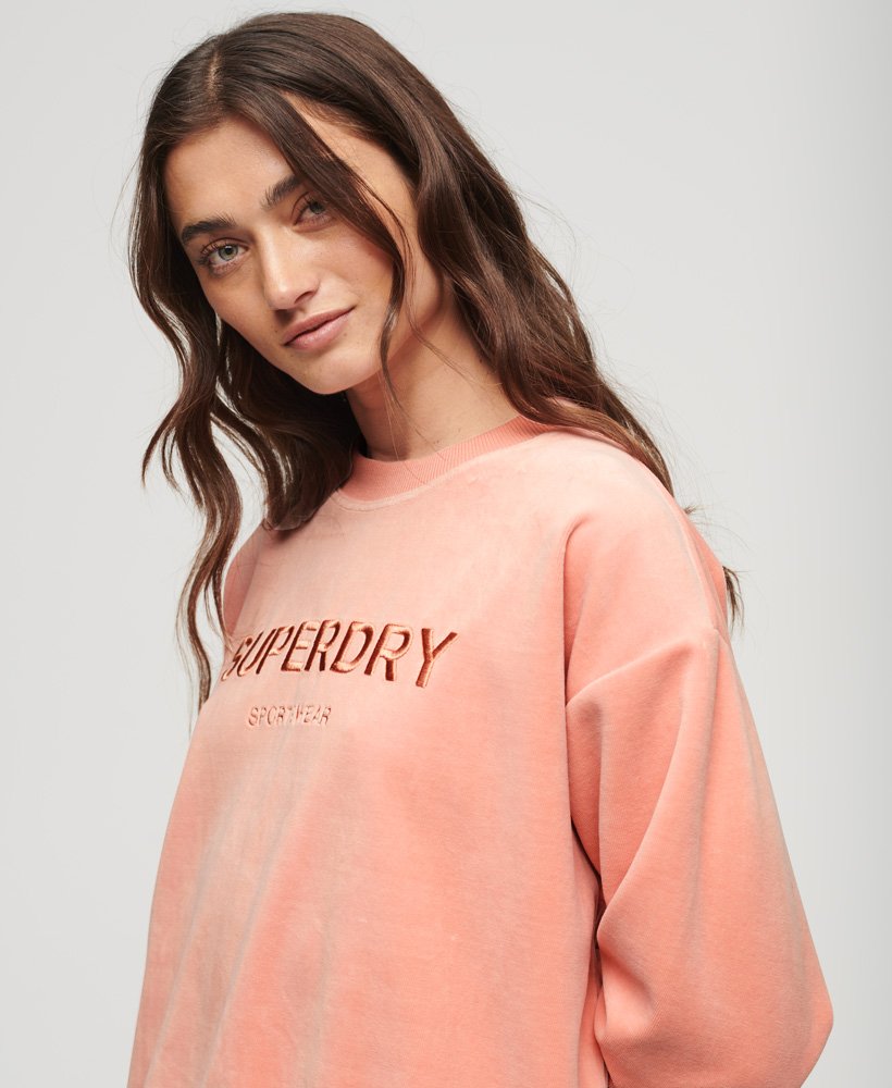velours sweatshirt met grafische print en wijde pasvorm in perzikbeige.