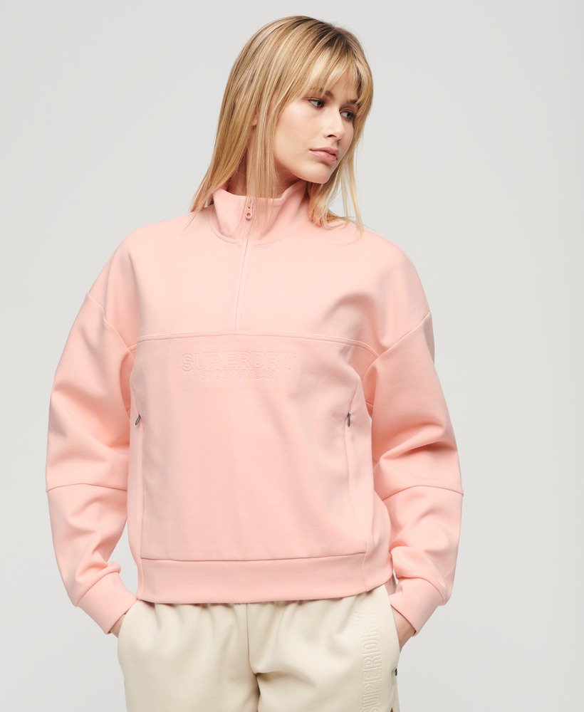 sport tech relaxed half zip in peach pearl pink