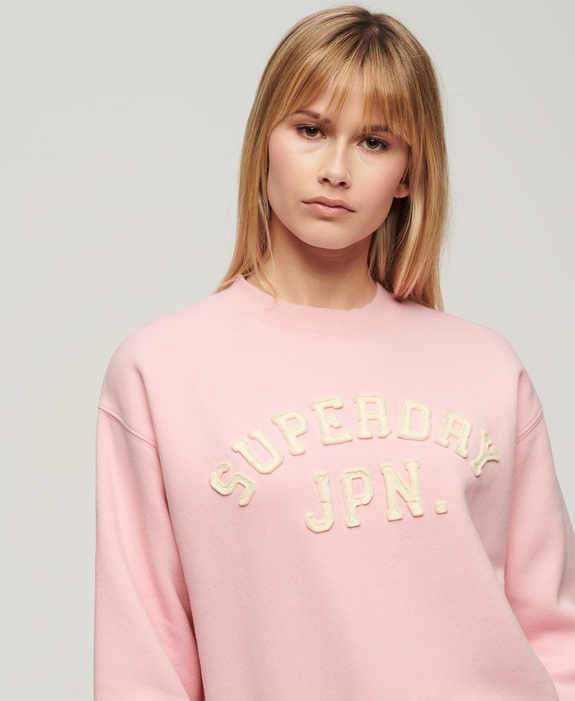 appliqué sportieve losse sweater in romantisch roze.