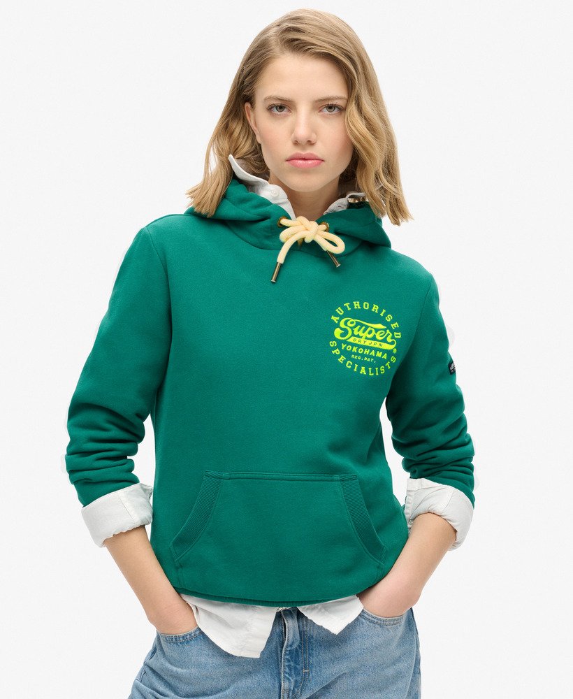 neonkleurige hoodie met geborduurde graphic in stormgroen