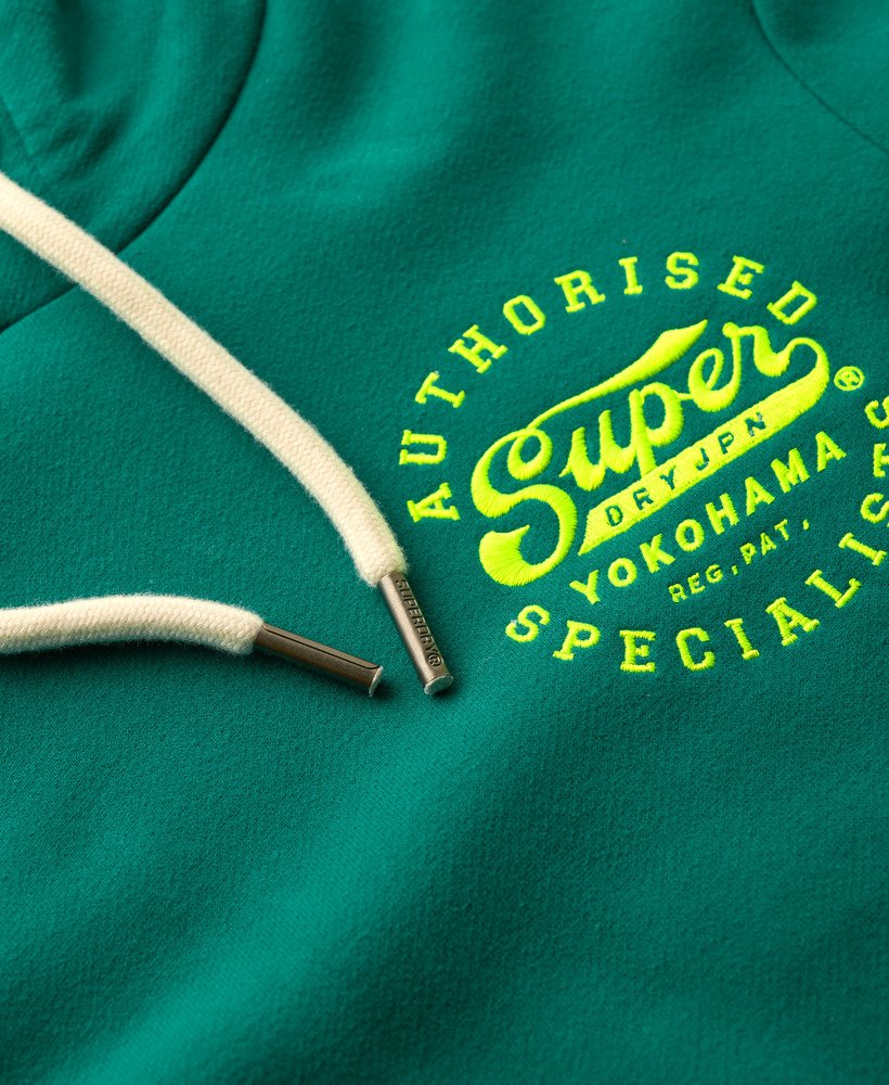 neonkleurige hoodie met geborduurde graphic in stormgroen