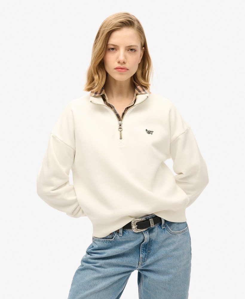 essentiële half-zip sweater in gebroken wit.