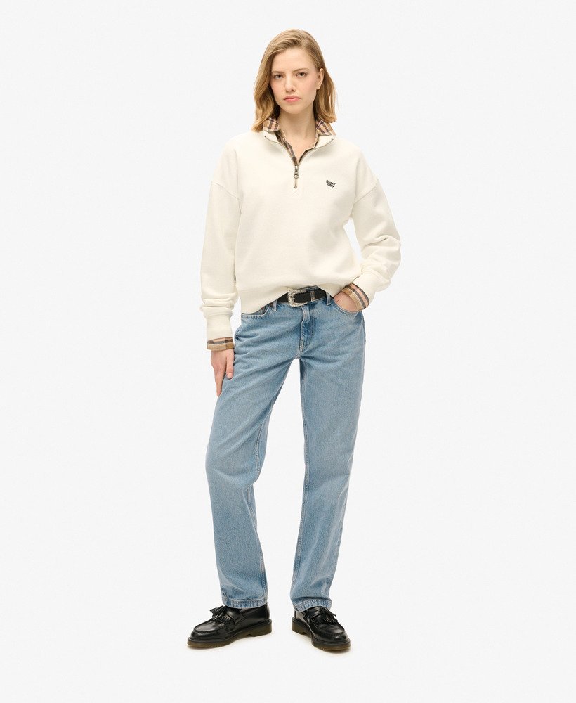 essentiële half-zip sweater in gebroken wit.