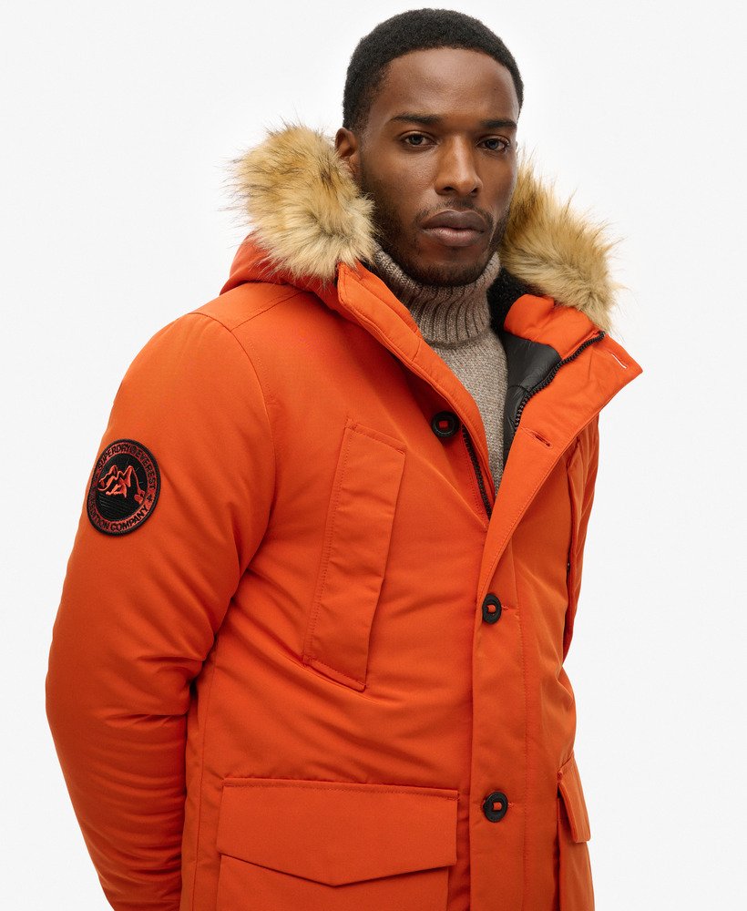 everest parka met capuchon van imitatiebont in de kleur gepureerde pompoen.