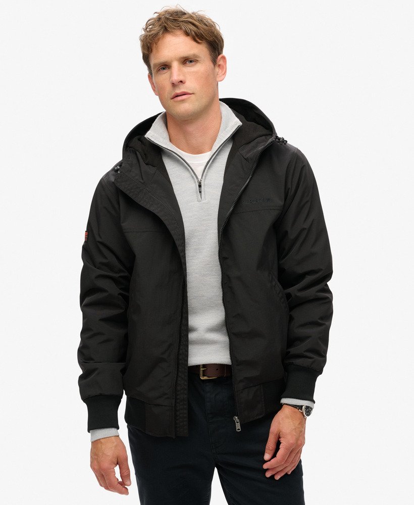 overgebleven nylon bomberjack met capuchon in gitzwart.