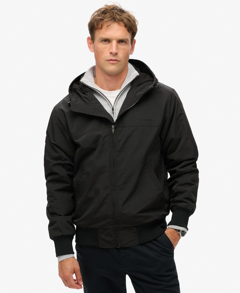 overgebleven nylon bomberjack met capuchon in gitzwart.