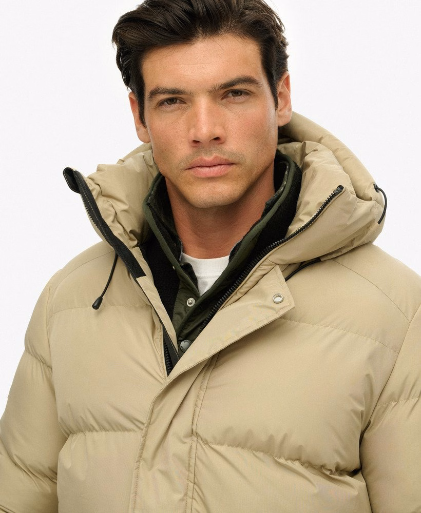 Sportieve pufferjas met capuchon, middellang model