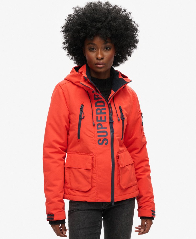 capuchonjack ultimate sd-windcheater in opvallend oranjediepblauw