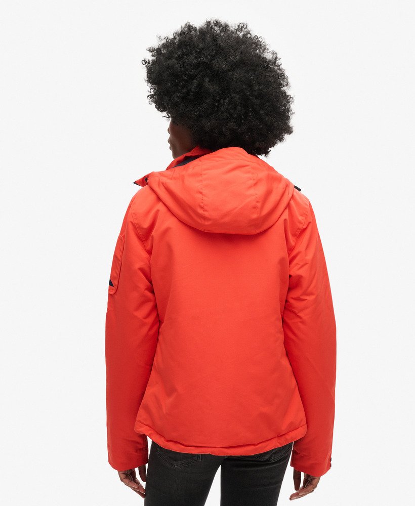 capuchonjack ultimate sd-windcheater in opvallend oranjediepblauw