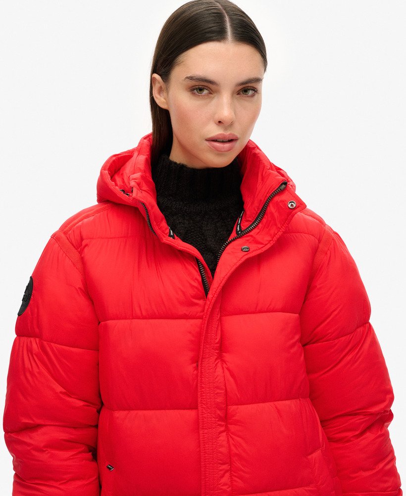 cocoon longline puffer coat in high risk red