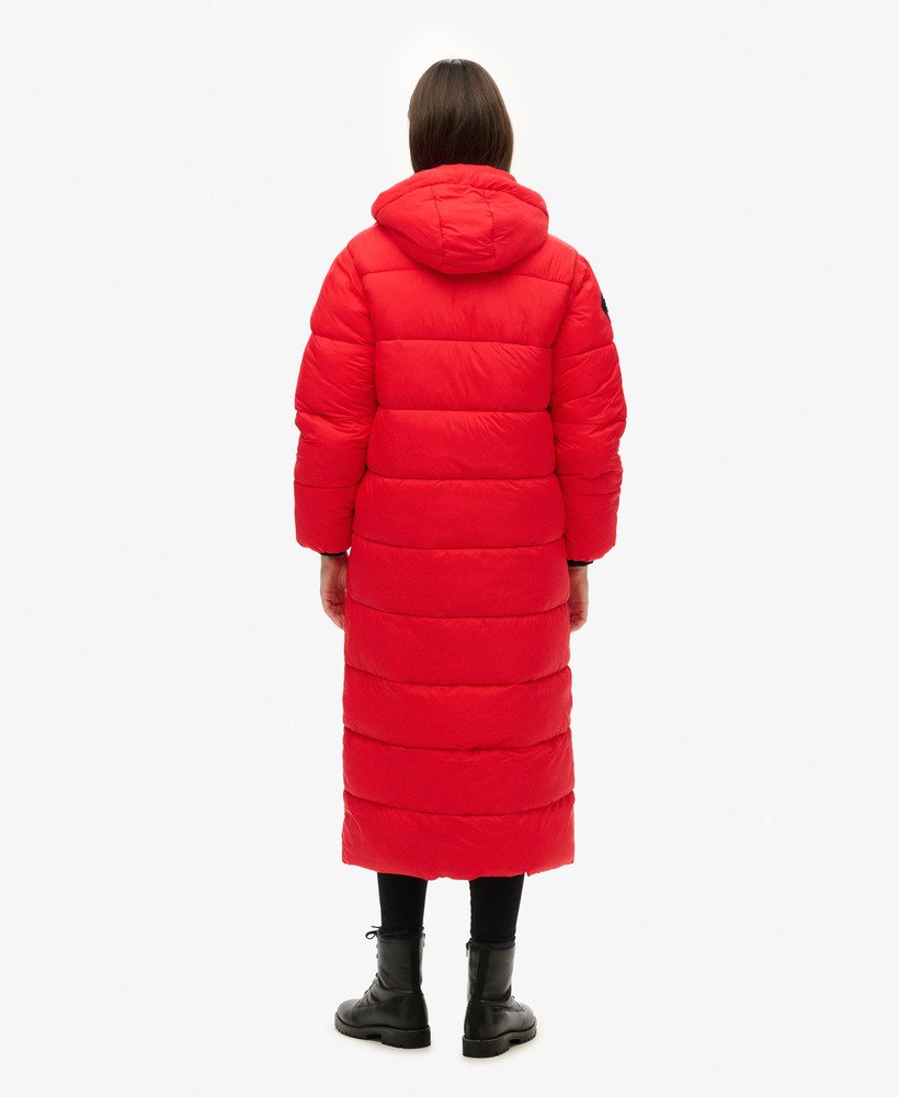 cocoon longline puffer coat in high risk red