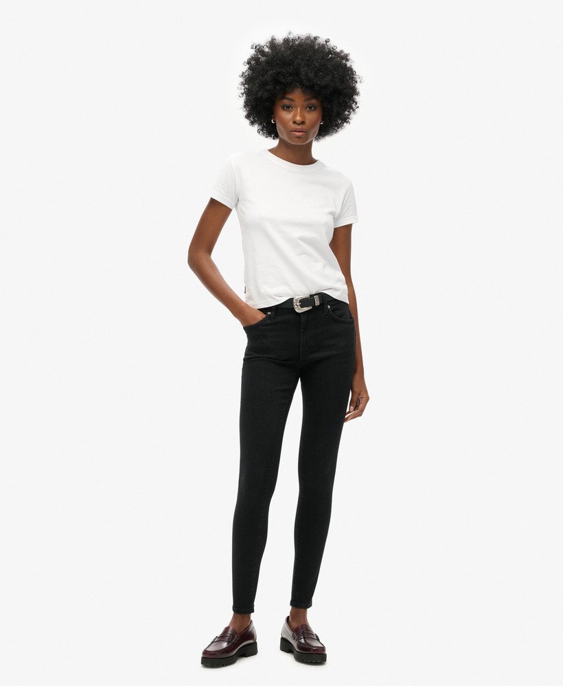 vintage skinny jeans met middelhoge taille van biologisch katoen in zwarte wassing.