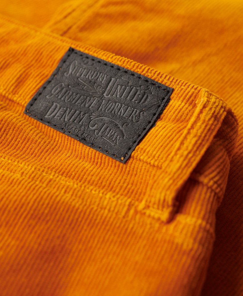 laag uitlopende corduroy jeans met tailleband in pompoenkruidbruin