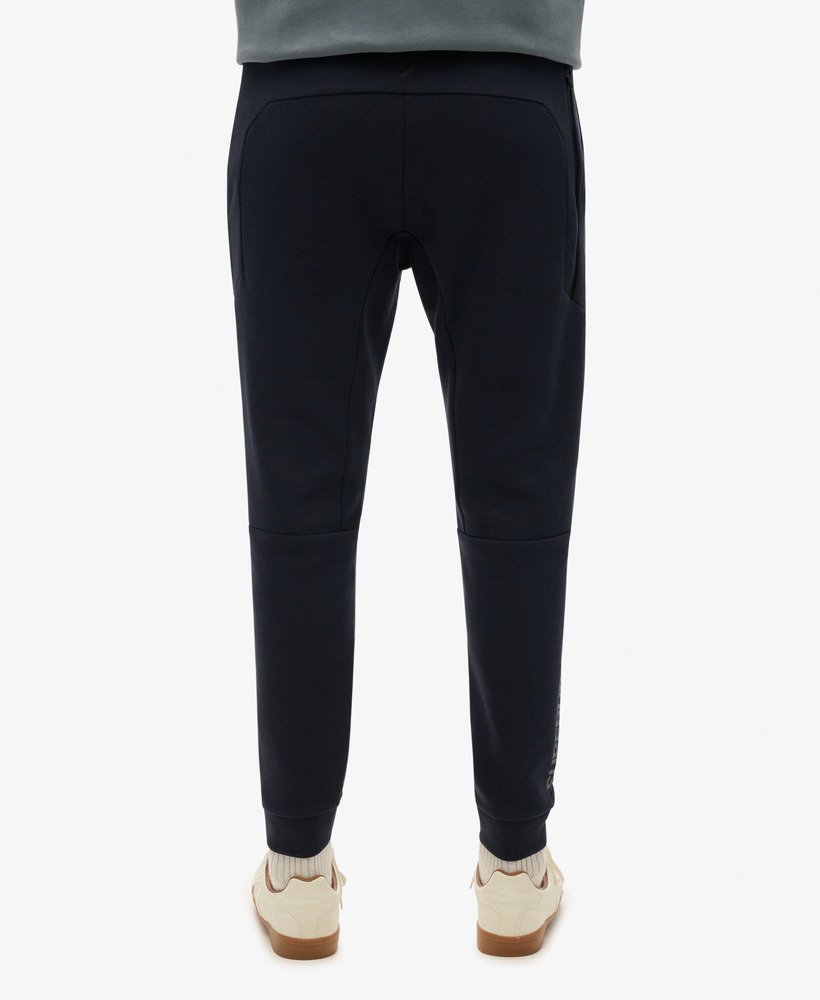 sport tech logo tapered joggers in eclipse navy