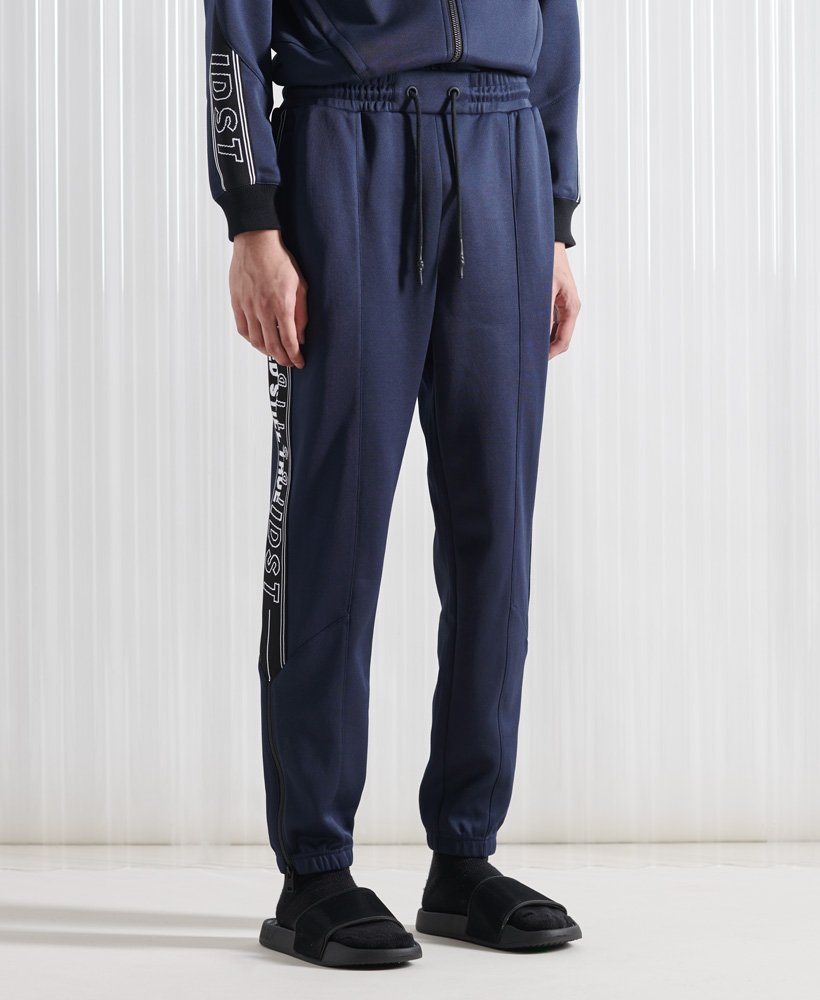 limited edition sdx unisex peep track jogger in marineblauw