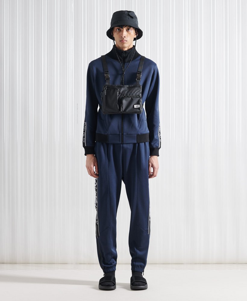 limited edition sdx unisex peep track jogger in marineblauw