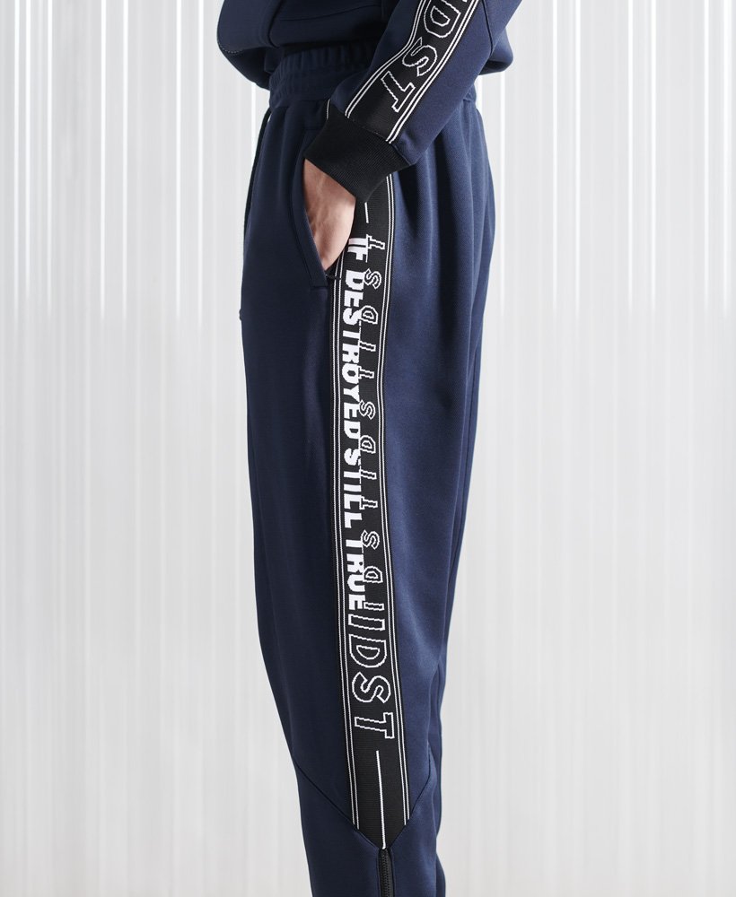 limited edition sdx unisex peep track jogger in marineblauw