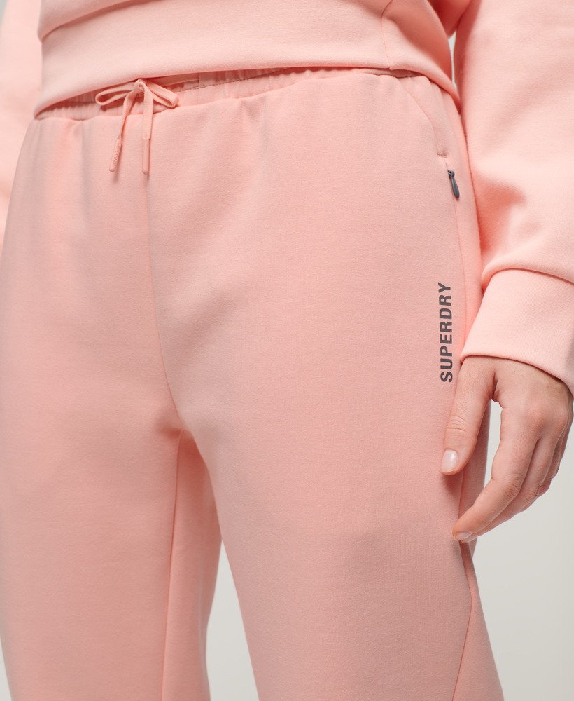 sports tech slim joggers in peach pearl pink