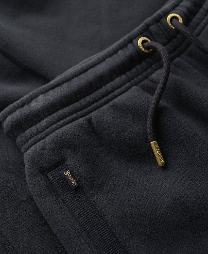 essential logo joggingbroek met manchetten in een prachtige marineblauwe kleur
