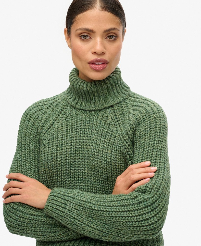 slouchy gebreide coltrui in donker saliegroen gemêleerd.