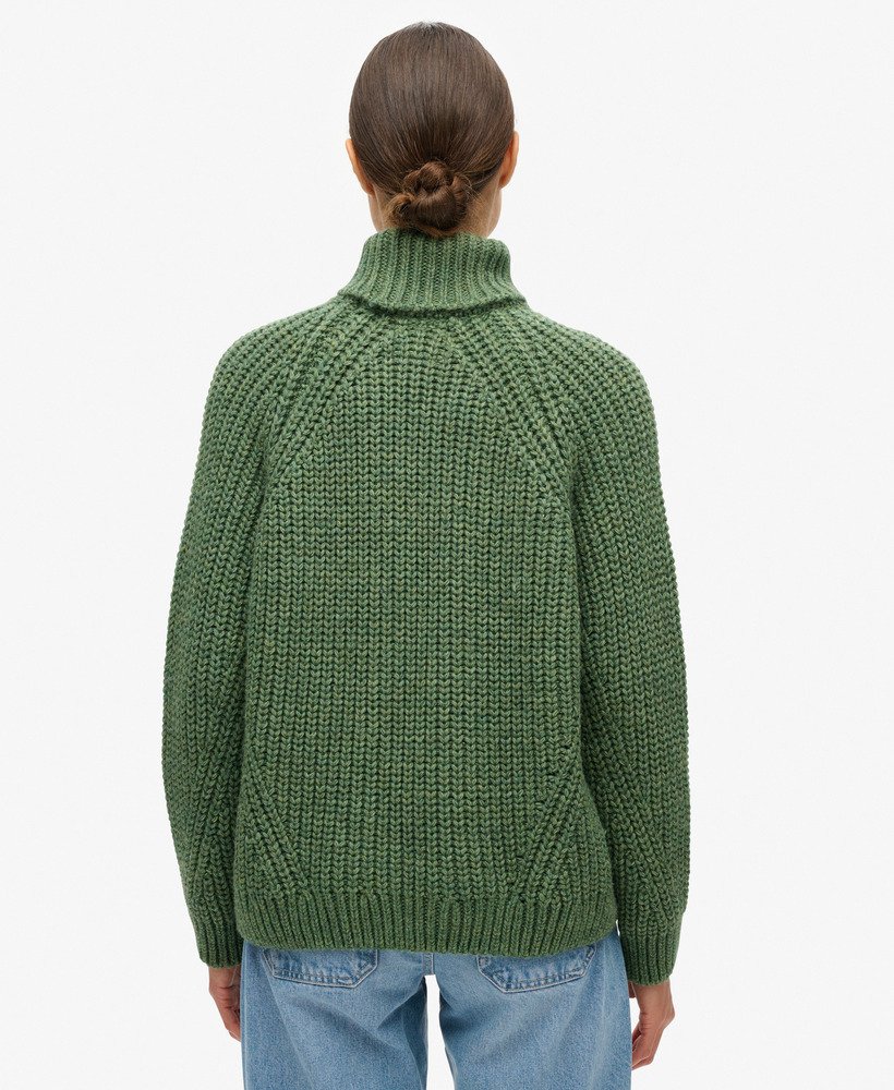 slouchy gebreide coltrui in donker saliegroen gemêleerd.