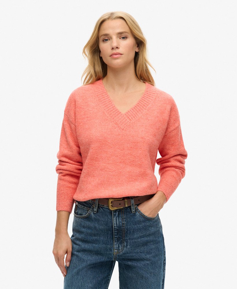 oversized v-hals trui in appeloranje gemêleerde kleur.