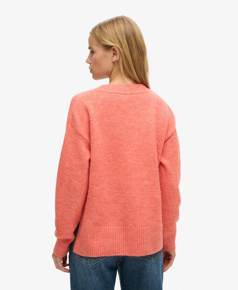 oversized v-hals trui in appeloranje gemêleerde kleur.