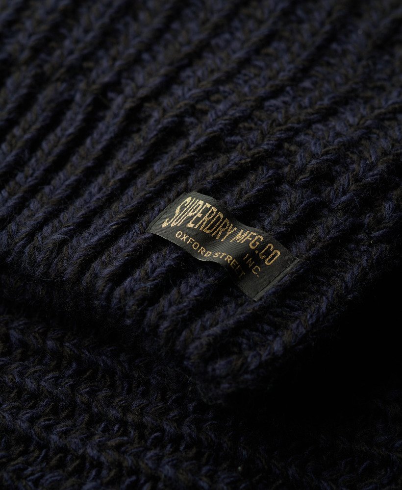 grof gebreid vest met ritssluiting in marineblauw en zwart met een twist.