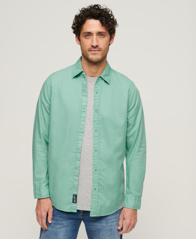 overgeverfd biologisch katoenen shirt met lange mouwen in fluorescerend turquoise.