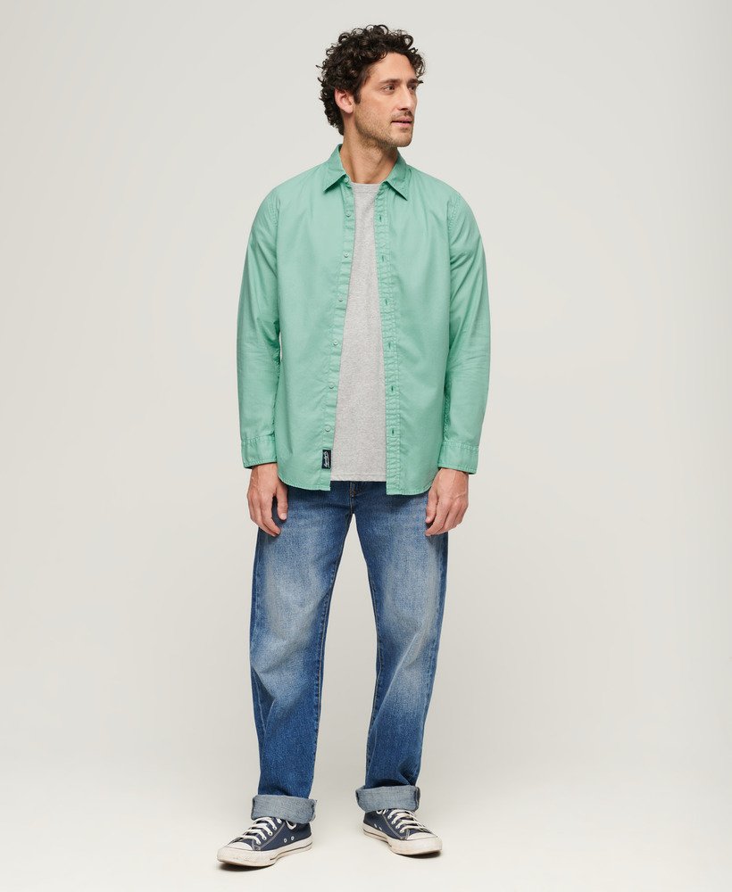 overgeverfd biologisch katoenen shirt met lange mouwen in fluorescerend turquoise.