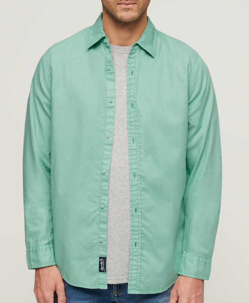overgeverfd biologisch katoenen shirt met lange mouwen in fluorescerend turquoise.
