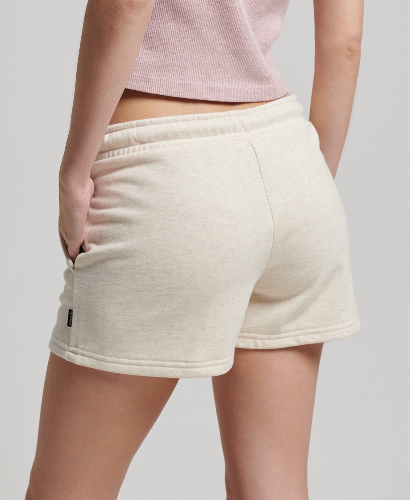 vintage jersey shorts met geborduurd logo in licht havermoutkleur.