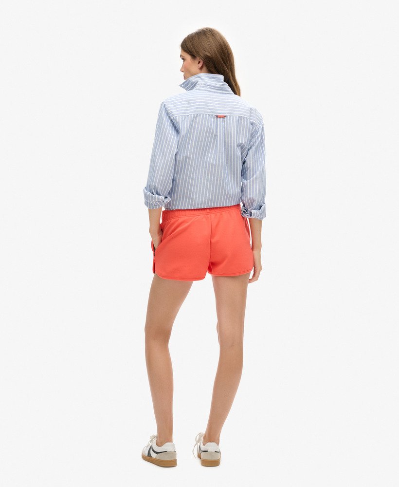 sports tech racer shorts in hot coral